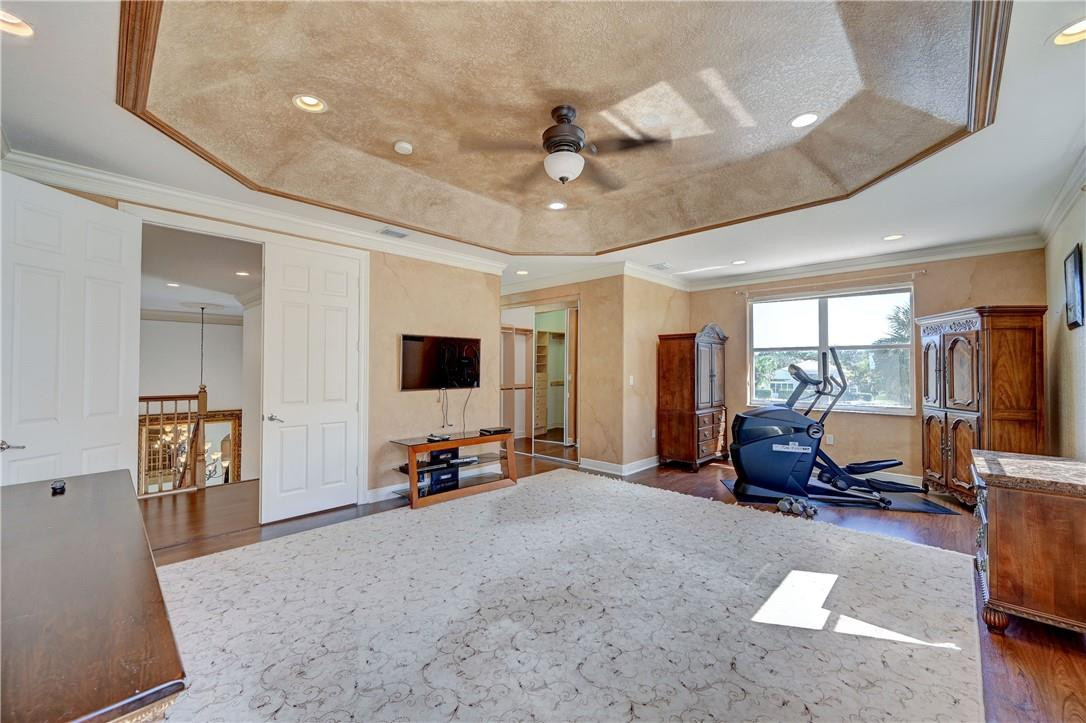 19168 Skyridge Circle Boca Raton, FL 33498 - Photo 25 of 55 a living room with gym equipment and a large window