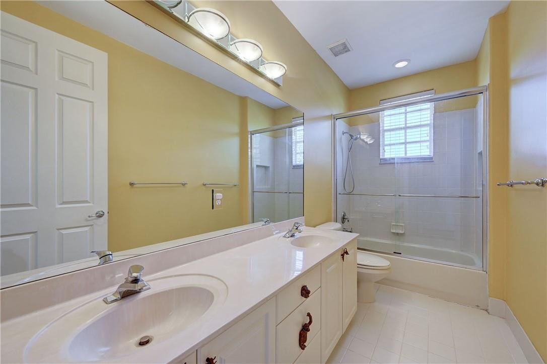 19168 Skyridge Circle Boca Raton, FL 33498 - Photo 35 of 55 a bathroom with a tub sink and mirror
