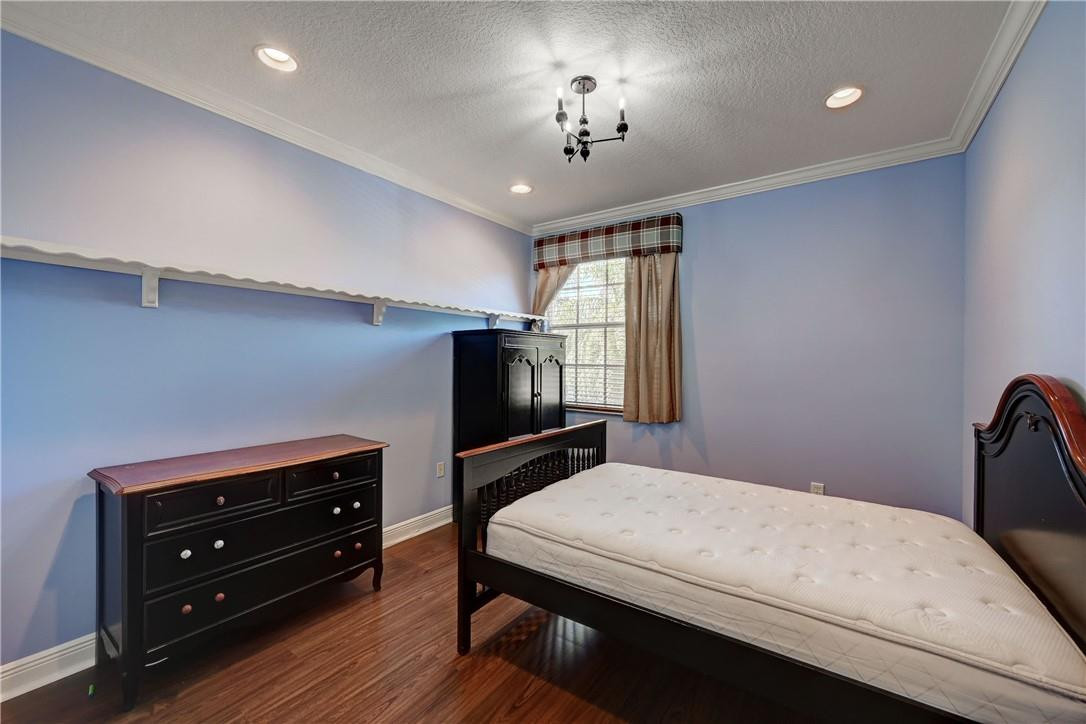 19168 Skyridge Circle Boca Raton, FL 33498 - Photo 36 of 55 a bedroom with a bed and a fireplace