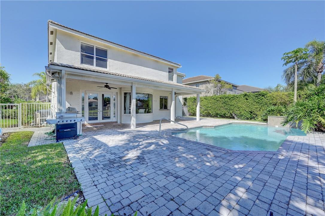 19168 Skyridge Circle Boca Raton, FL 33498 - Photo 45 of 55 a view of a house with backyard porch and garden