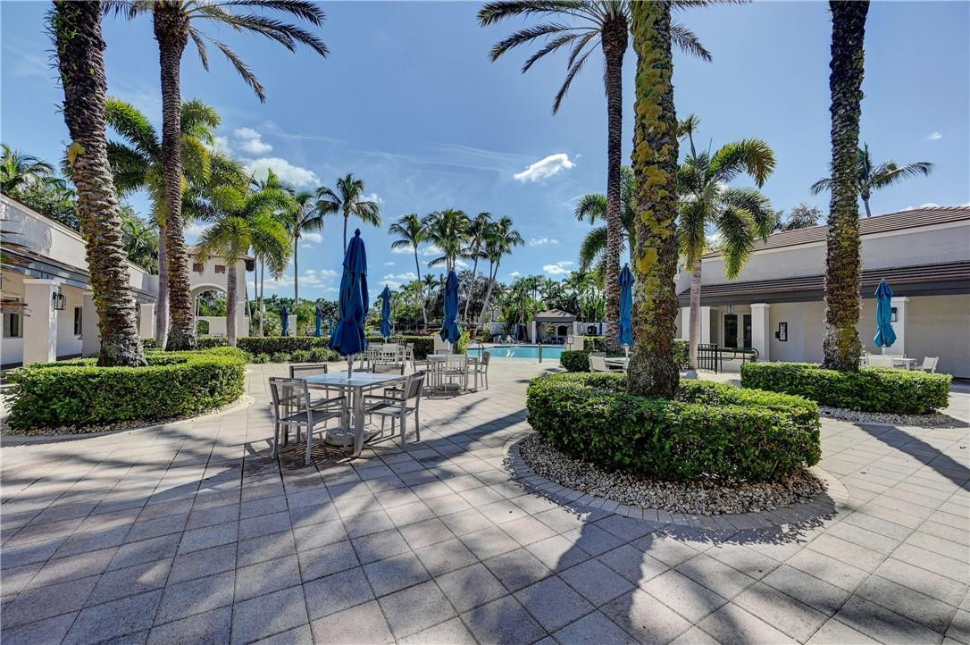 19168 Skyridge Circle Boca Raton, FL 33498 - Photo 48 of 55 a view of a building with a garden and sitting area