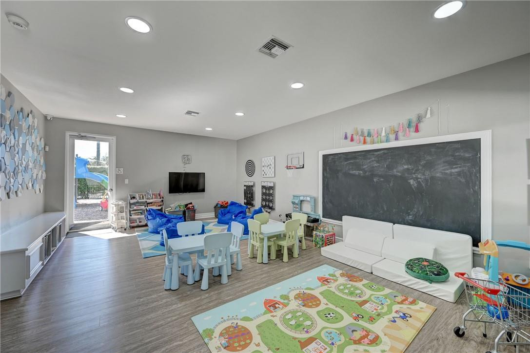19168 Skyridge Circle Boca Raton, FL 33498 - Photo 49 of 55 a living room with furniture and a flat screen tv