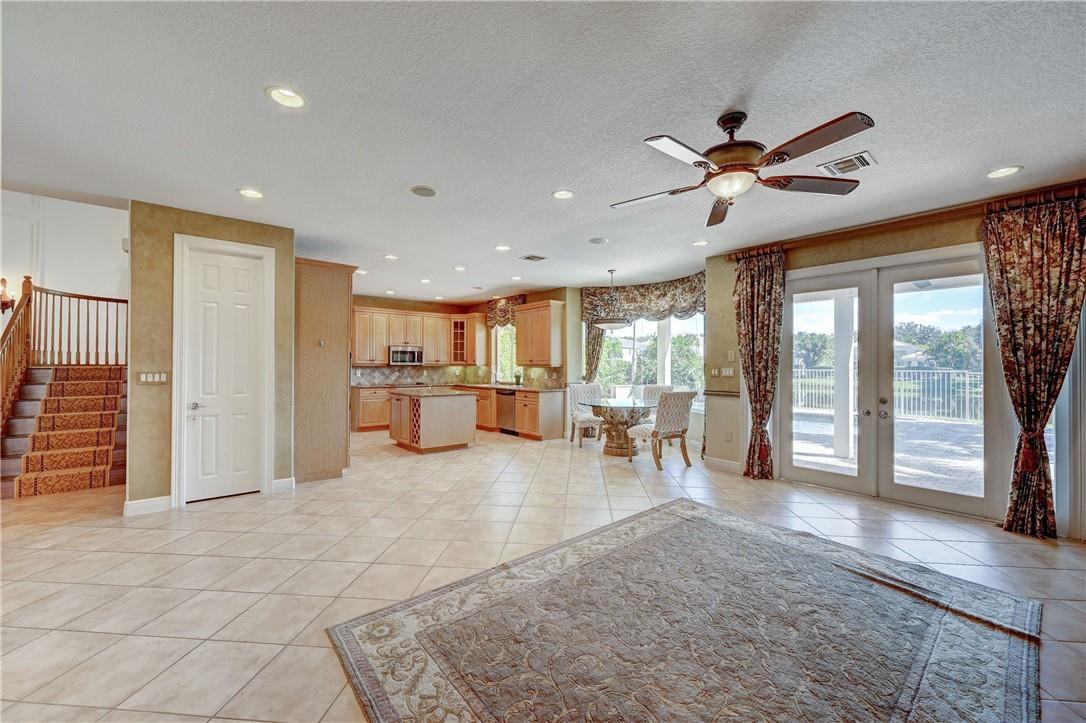 19168 Skyridge Circle Boca Raton, FL 33498 - Photo 10 of 55 a view of a livingroom with furniture a ceiling fan and window