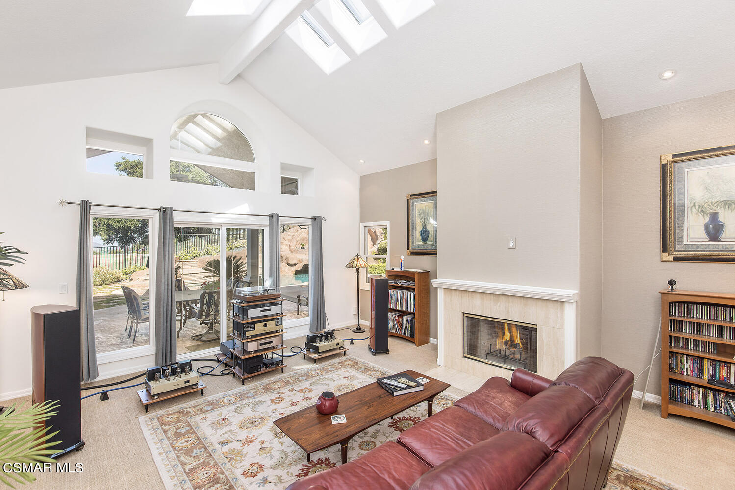 2234 Ranch View Place Thousand Oaks, CA 91362 - Photo 13 of 49 a living room with furniture a fireplace and a large window