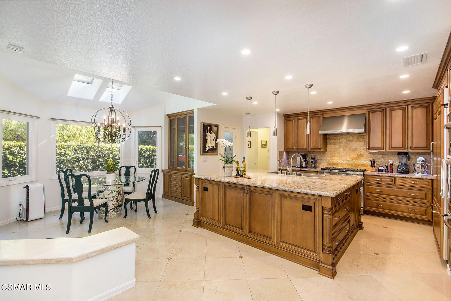 2234 Ranch View Place Thousand Oaks, CA 91362 - Photo 17 of 49 a large kitchen with kitchen island a sink table and chairs