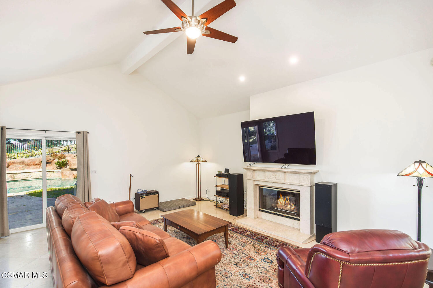 2234 Ranch View Place Thousand Oaks, CA 91362 - Photo 21 of 49 a living room with furniture a flat screen tv and a fireplace
