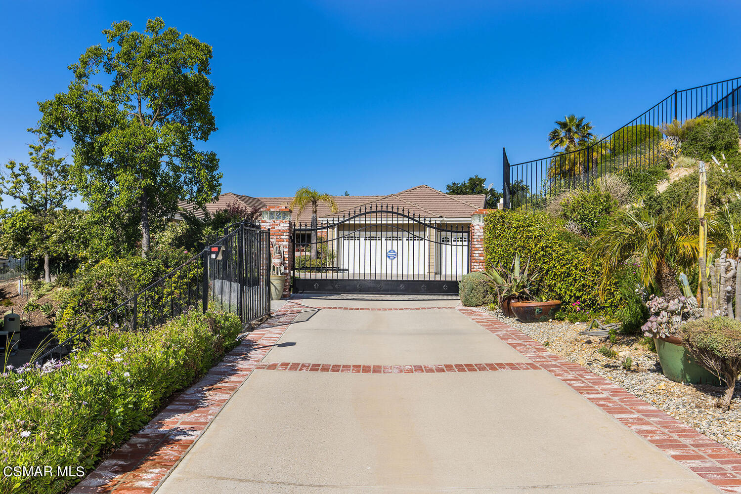 2234 Ranch View Place Thousand Oaks, CA 91362 - Photo 3 of 49 a view of a white house with a yard and plants
