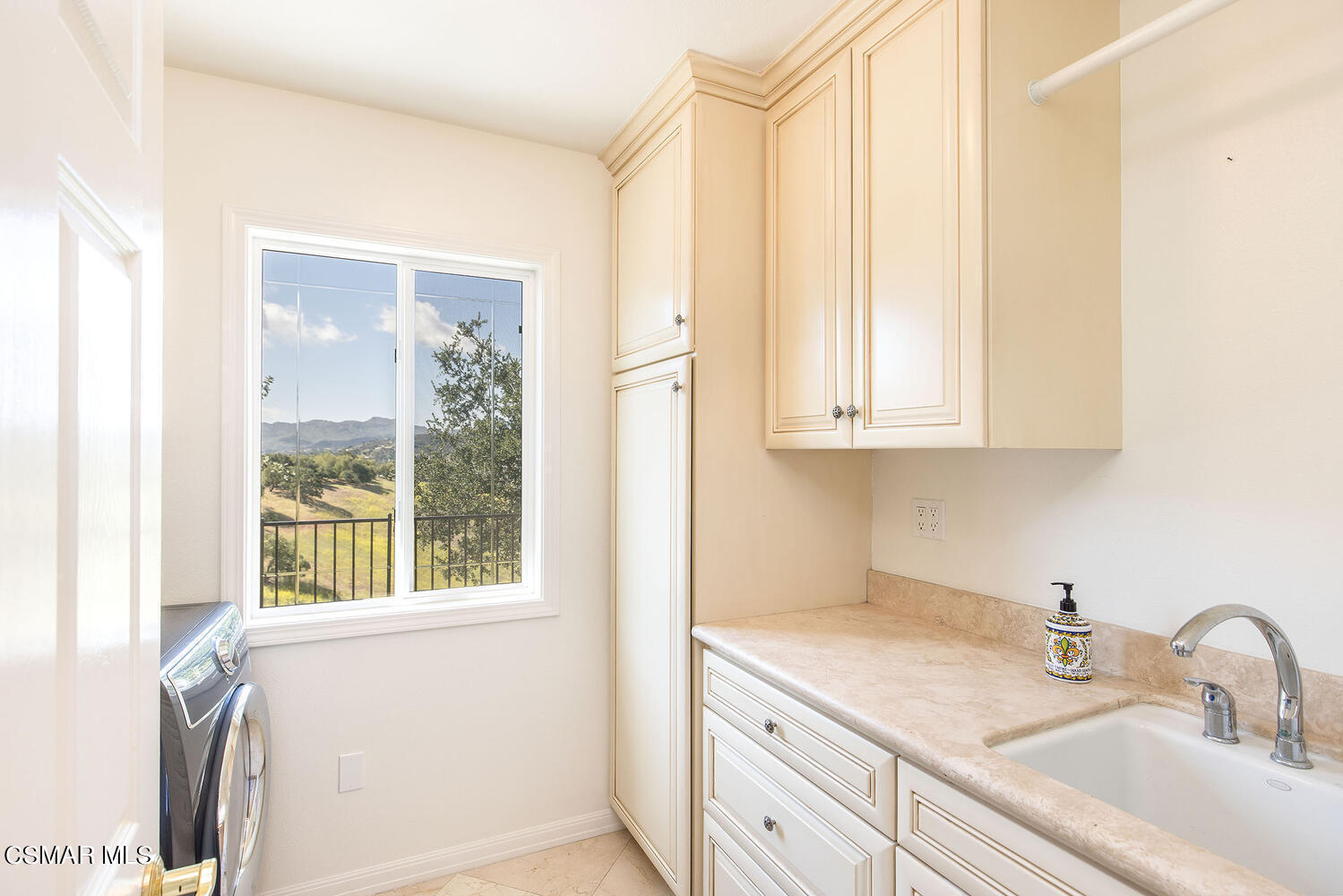 2234 Ranch View Place Thousand Oaks, CA 91362 - Photo 34 of 49 a kitchen with a sink a cabinets and window