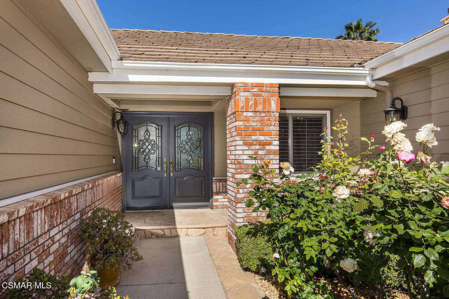 2234 Ranch View Place Thousand Oaks, CA 91362 - Photo 10 of 49 a front view of a house with a large window