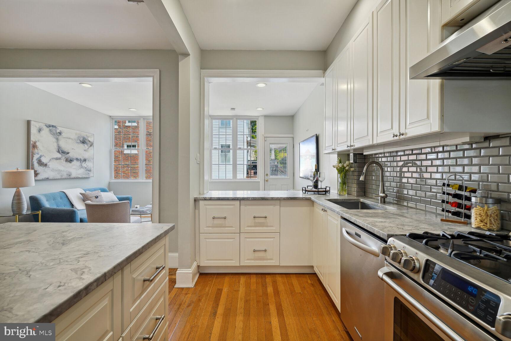 3863 Beecher Street Northwest Washington, DC 20007 - Photo 11 of 19 a kitchen with granite countertop a stove and a sink