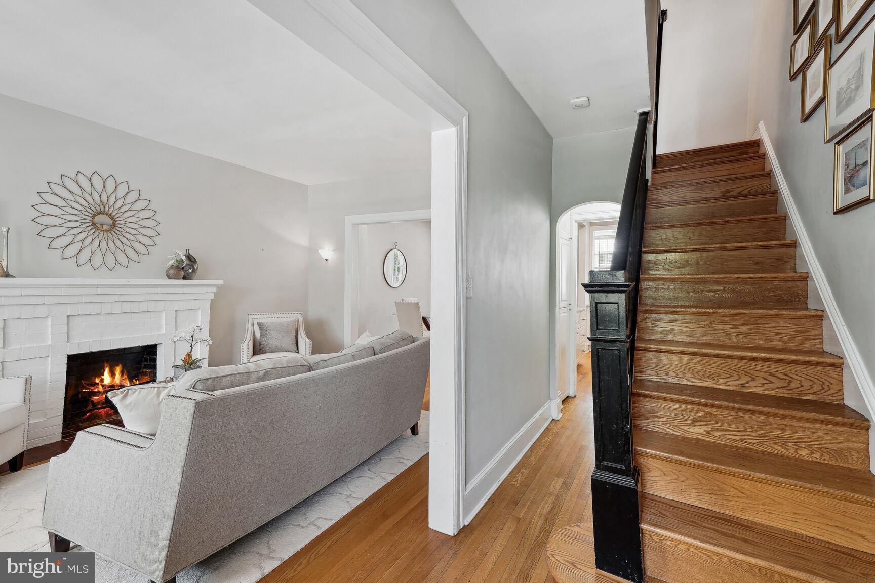 3863 Beecher Street Northwest Washington, DC 20007 - Photo 12 of 19 a living room with furniture and a fireplace
