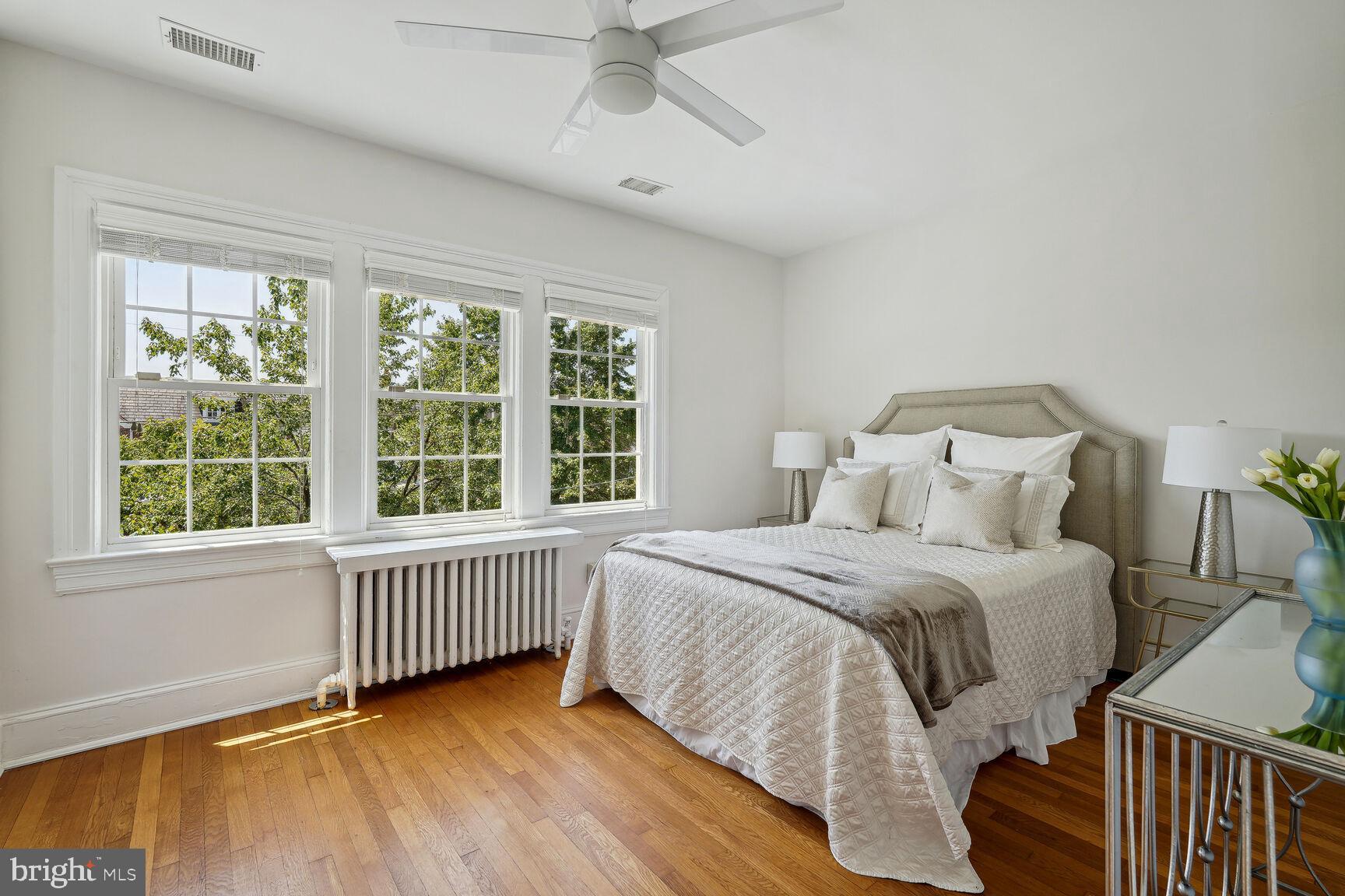 3863 Beecher Street Northwest Washington, DC 20007 - Photo 13 of 19 a bedroom with a bed and a window