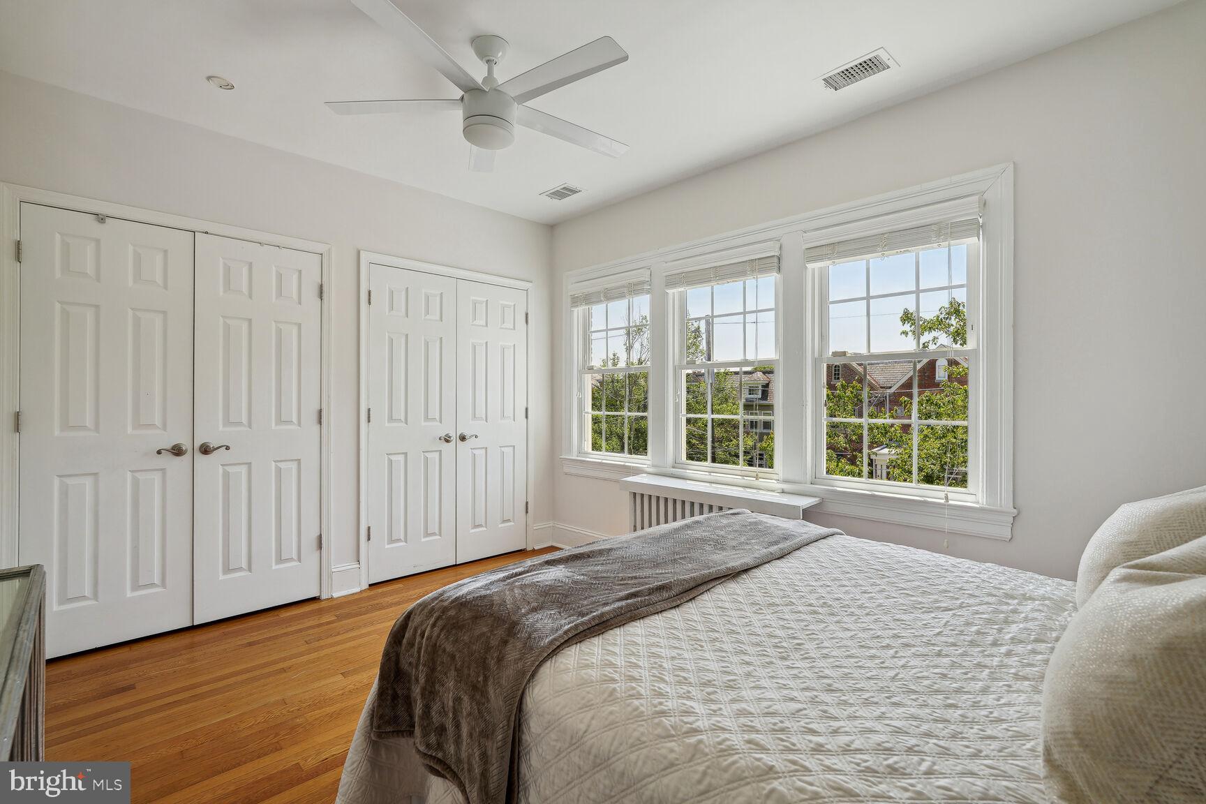 3863 Beecher Street Northwest Washington, DC 20007 - Photo 14 of 19 a bedroom with a large bed and a large window