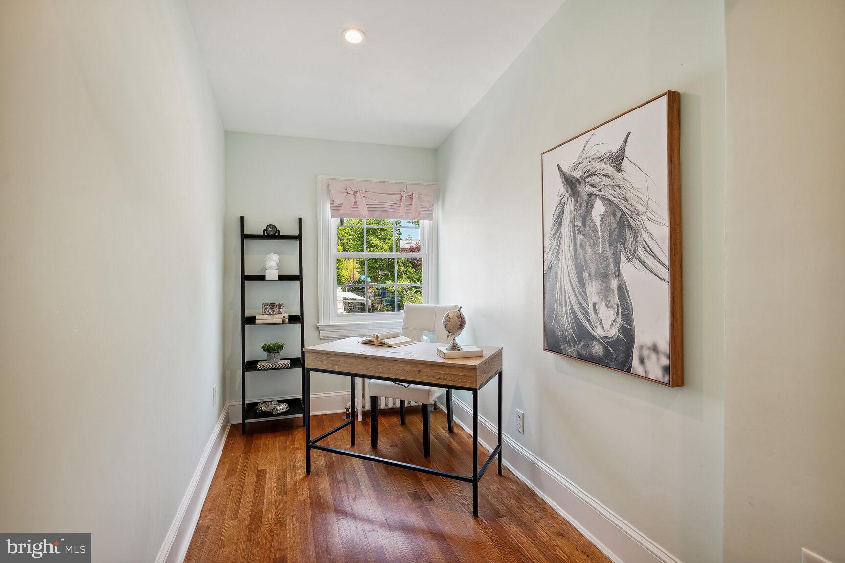3863 Beecher Street Northwest Washington, DC 20007 - Photo 18 of 19 a view of a workspace with furniture and wooden floor