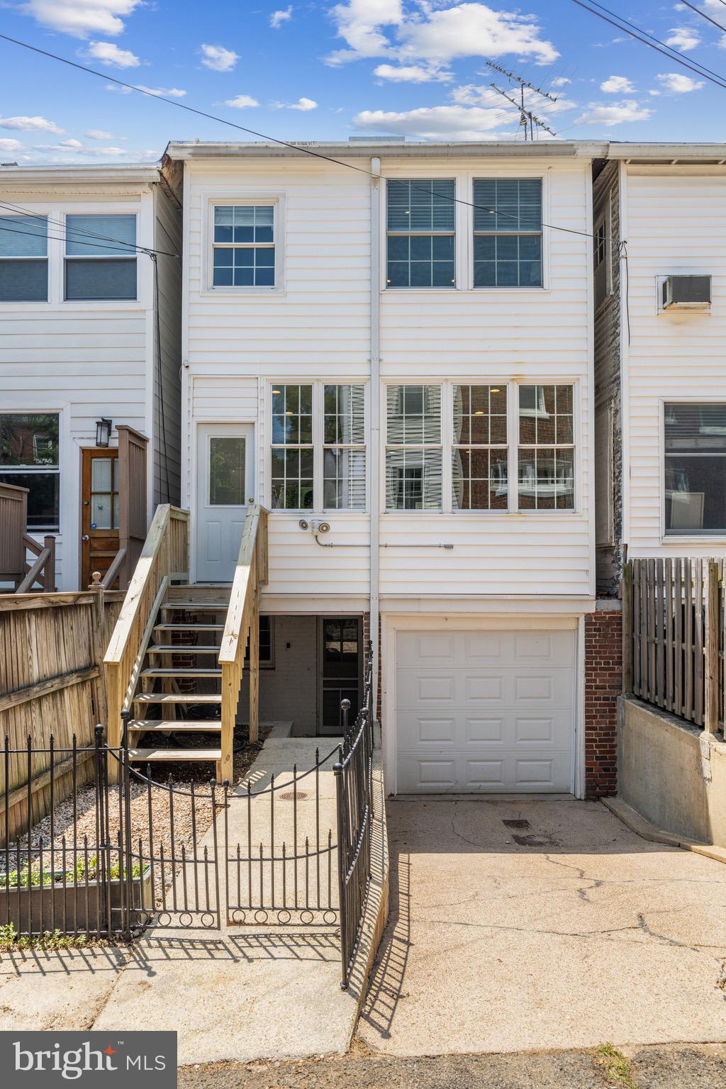 3863 Beecher Street Northwest Washington, DC 20007 - Photo 19 of 19 a front view of a house with a gate