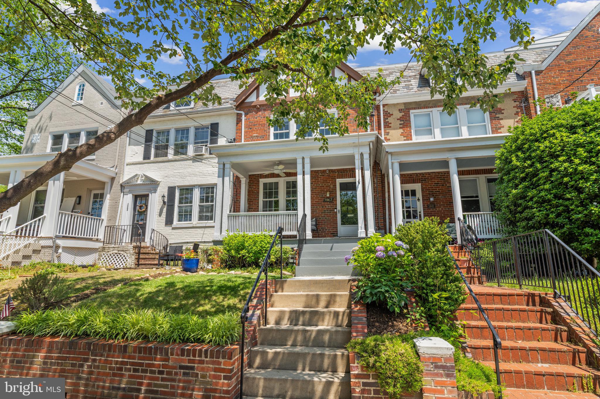 3863 Beecher Street Northwest Washington, DC 20007 - Photo 2 of 19 front view of a house with a yard