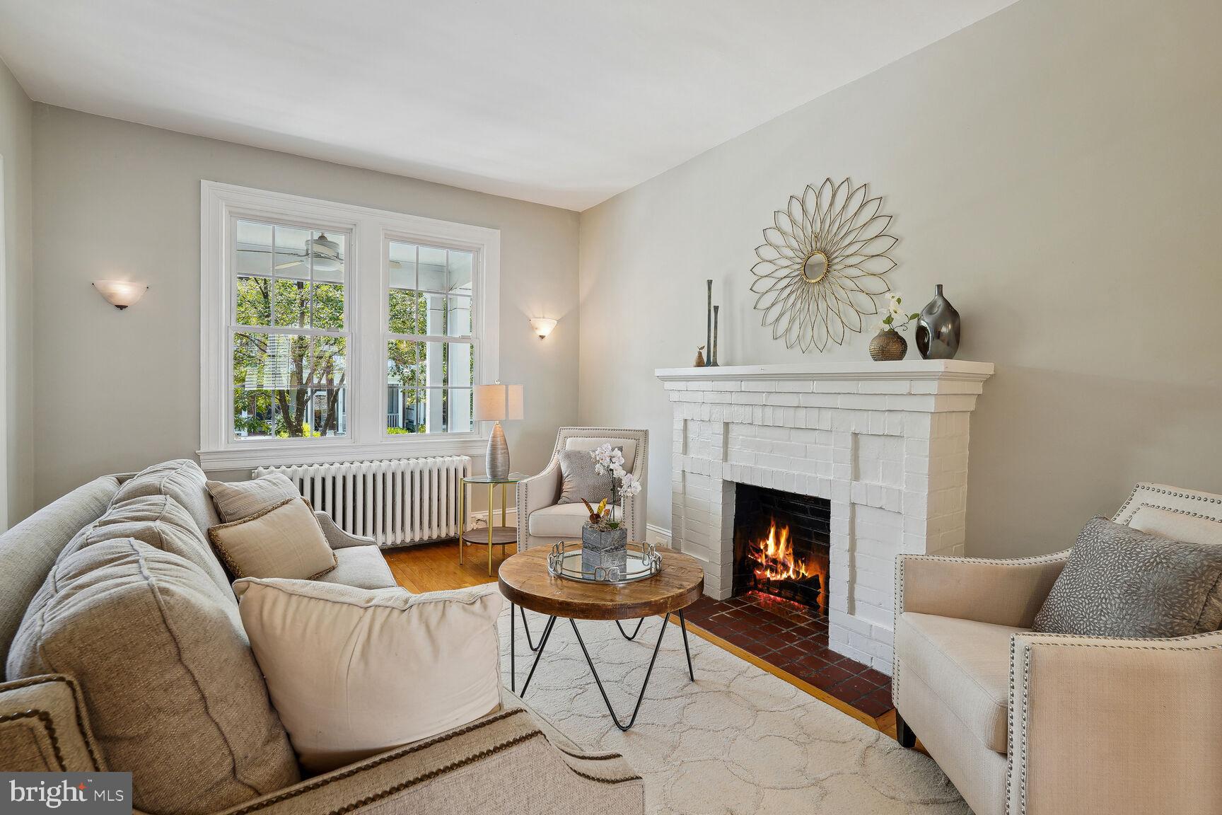 3863 Beecher Street Northwest Washington, DC 20007 - Photo 6 of 19 a living room with furniture and a fireplace