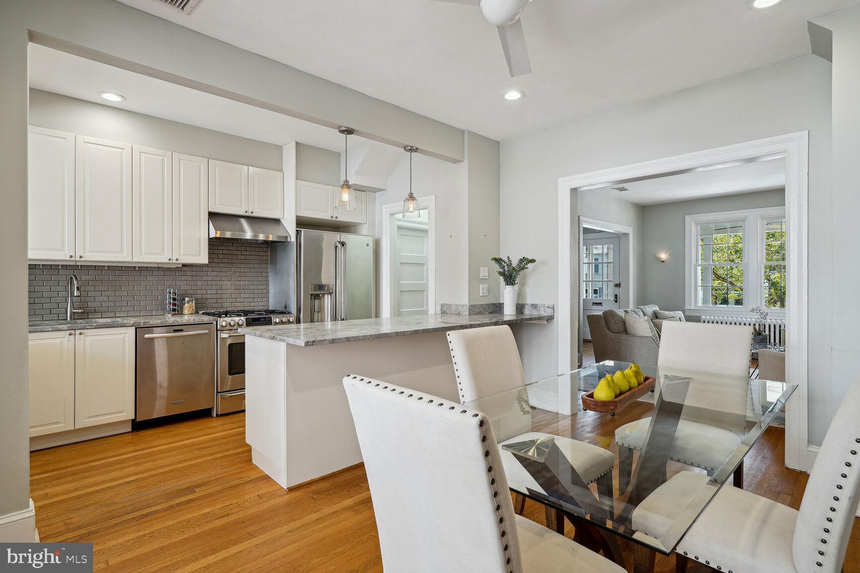 3863 Beecher Street Northwest Washington, DC 20007 - Photo 10 of 19 a living room with stainless steel appliances granite countertop furniture a couch and a view of kitchen