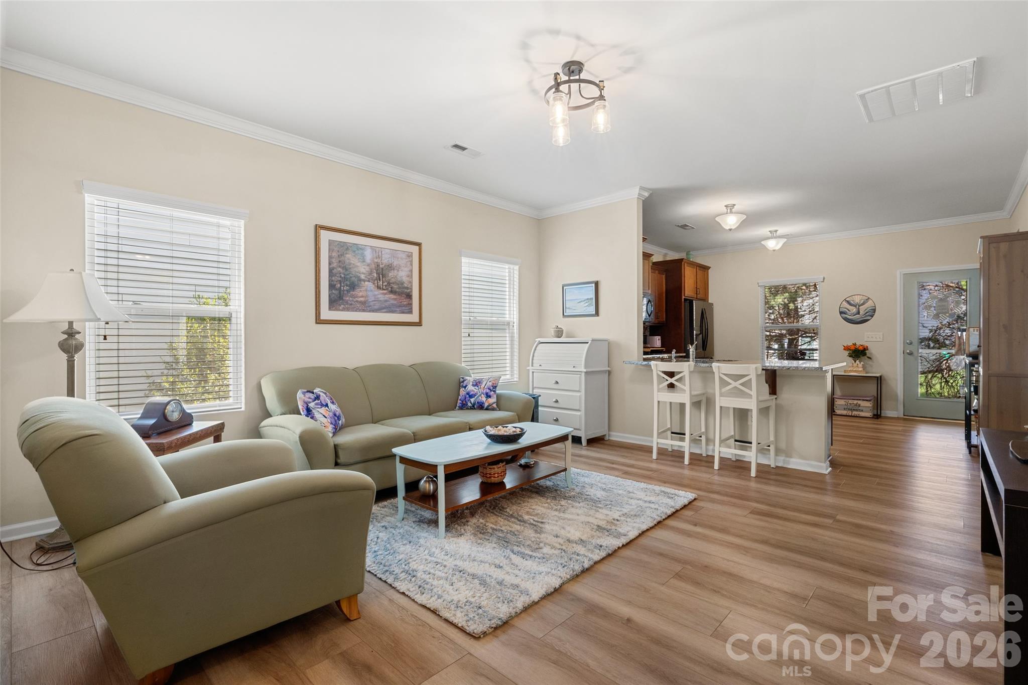 25320 Seagull Drive Lancaster, SC 29720 - Photo 11 of 37 a living room with furniture a wooden floor and a large window