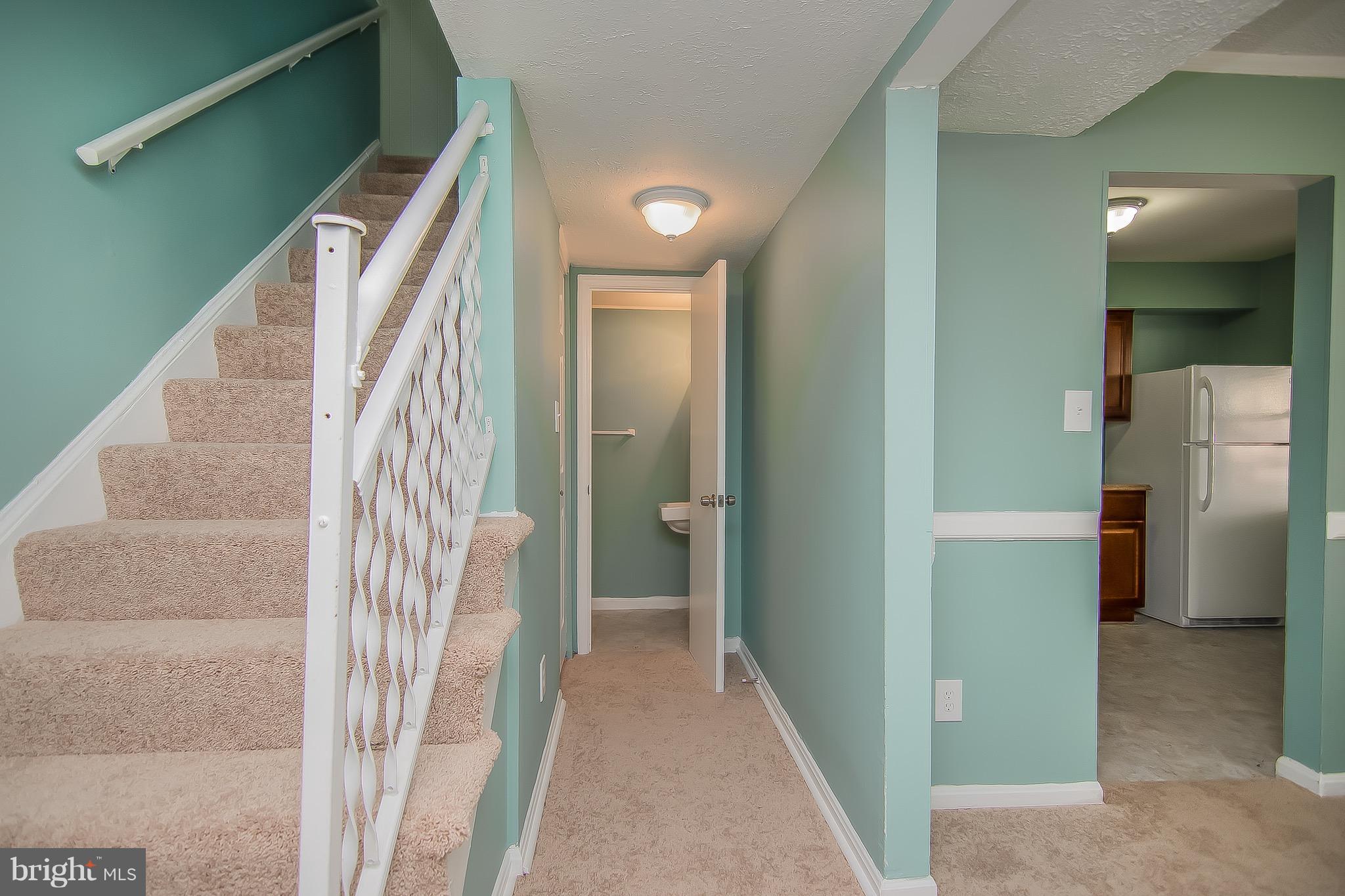 9845 Buckner Road Manassas, VA 20110 - Photo 2 of 19 a view of a hallway with entryway and stairs
