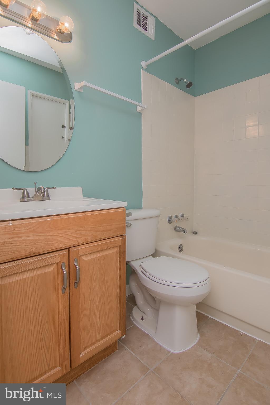 9845 Buckner Road Manassas, VA 20110 - Photo 13 of 19 a bathroom with a sink toilet and a mirror