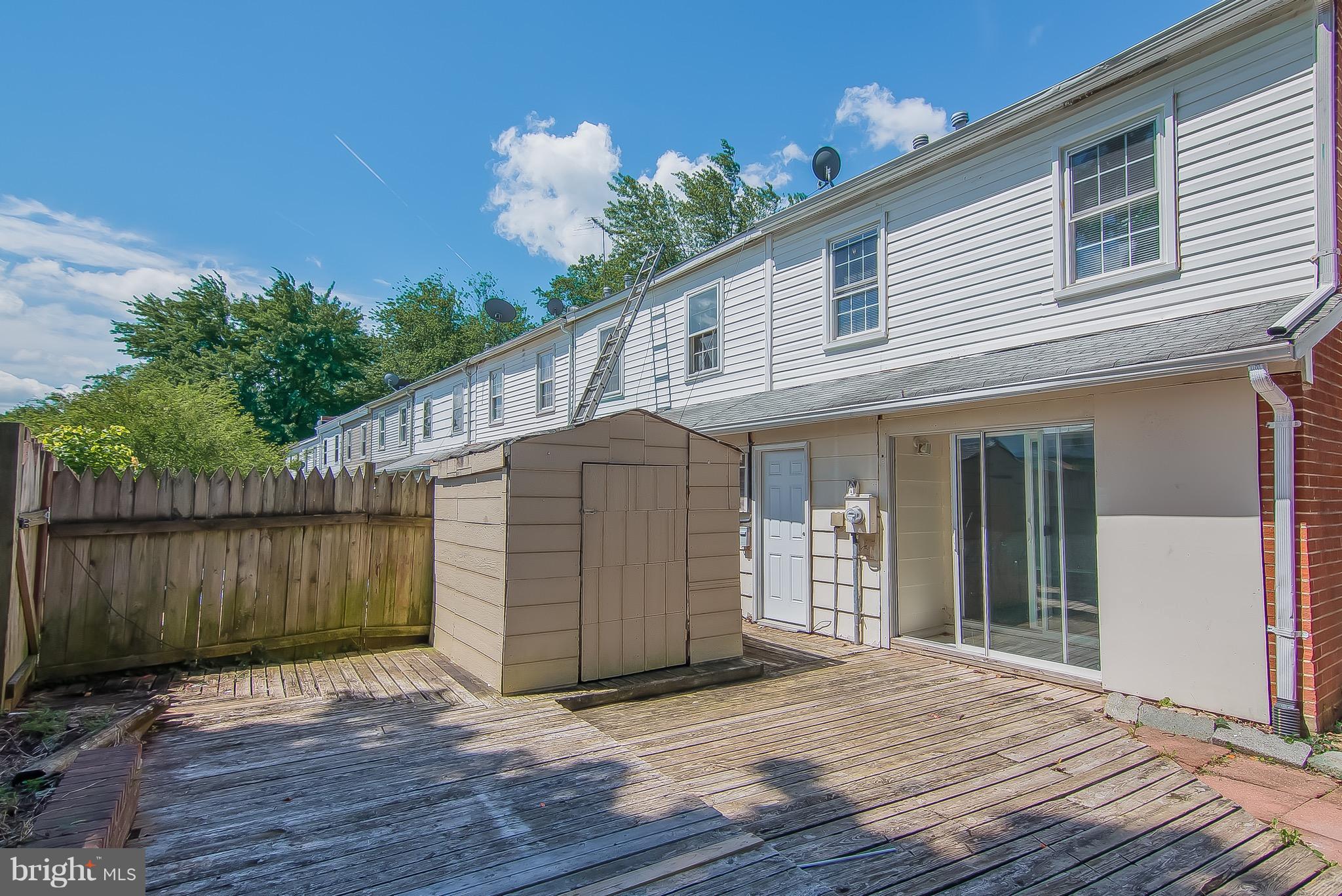 9845 Buckner Road Manassas, VA 20110 - Photo 17 of 19 a porch with seating space and hardwood floor