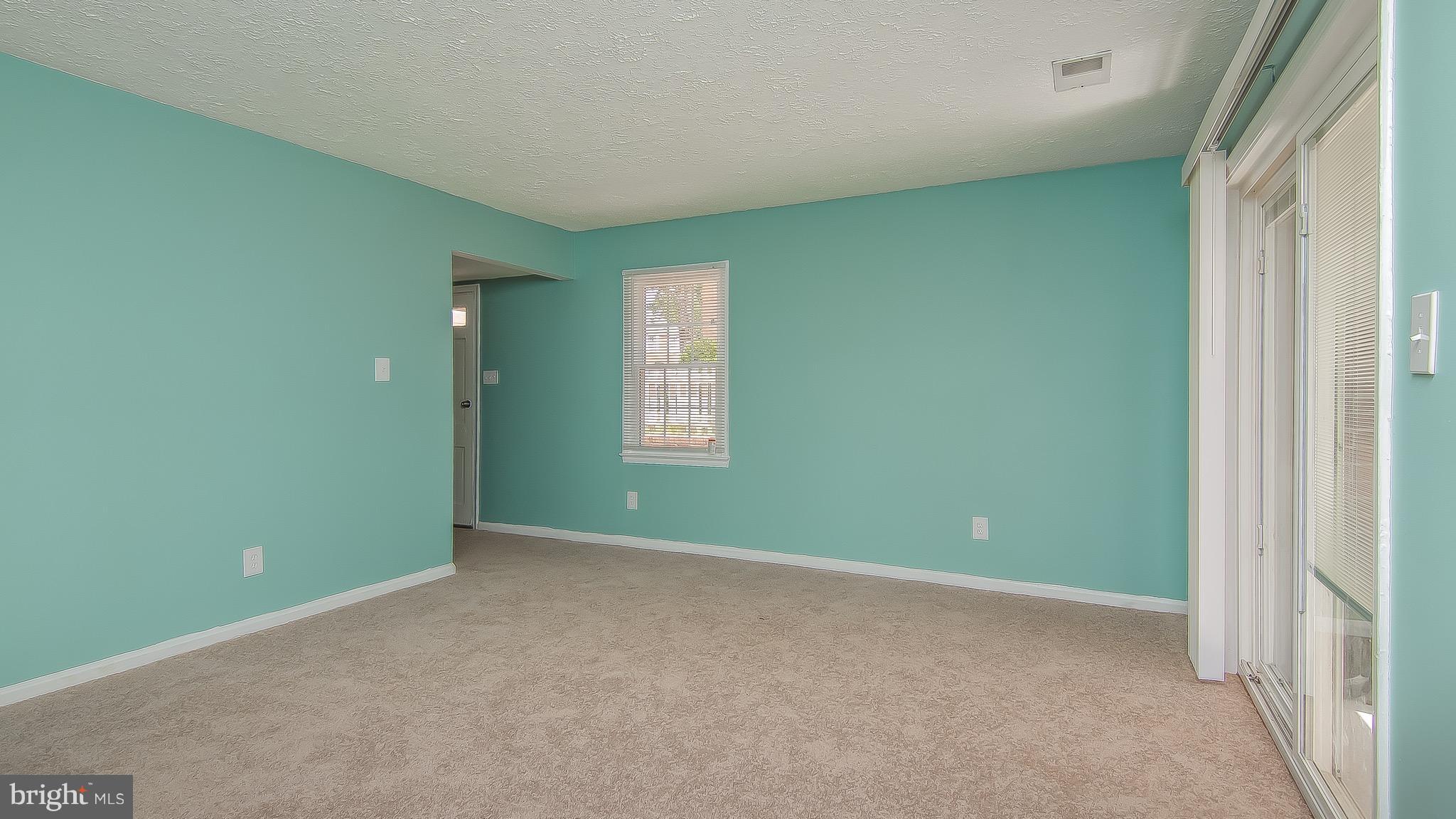 9845 Buckner Road Manassas, VA 20110 - Photo 4 of 19 a view of an empty room with closet and window
