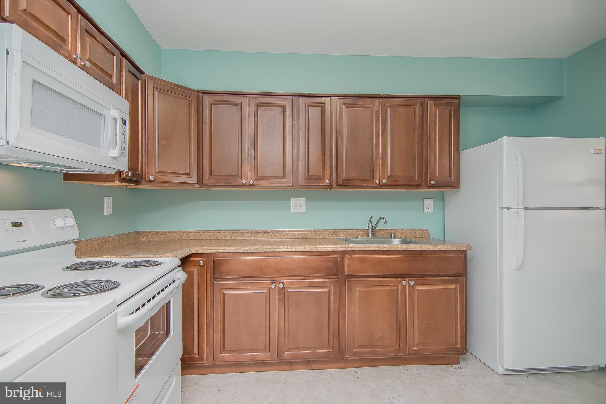 9845 Buckner Road Manassas, VA 20110 - Photo 8 of 19 a kitchen with stainless steel appliances granite countertop a refrigerator and a sink