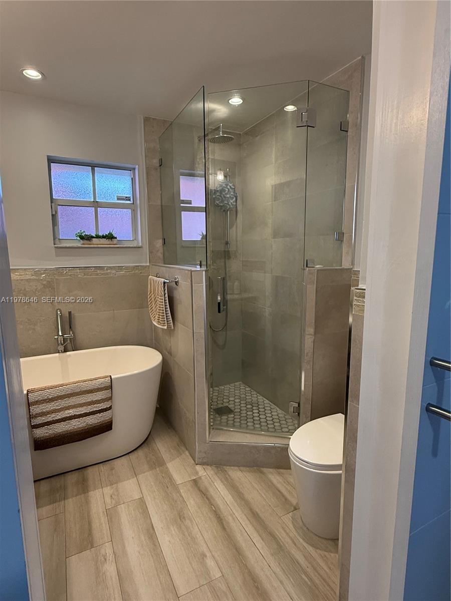 13833 Southwest 157th Street Miami, FL 33177 - Photo 16 of 25 a bathroom with a sink a toilet and shower