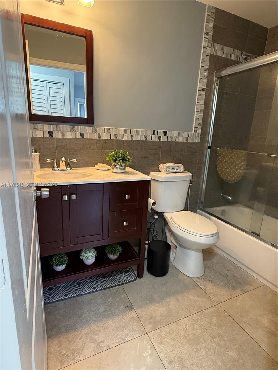 13833 Southwest 157th Street Miami, FL 33177 - Photo 21 of 25 a bathroom with a sink toilet and shower