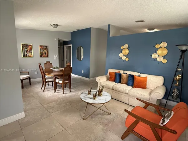 a living room with furniture and rug