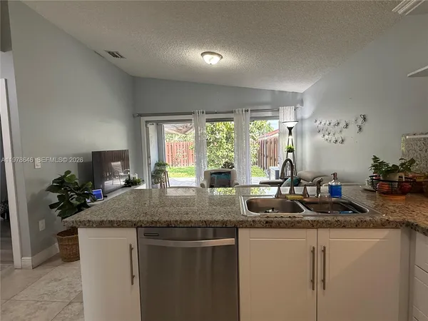 a kitchen with sink and window