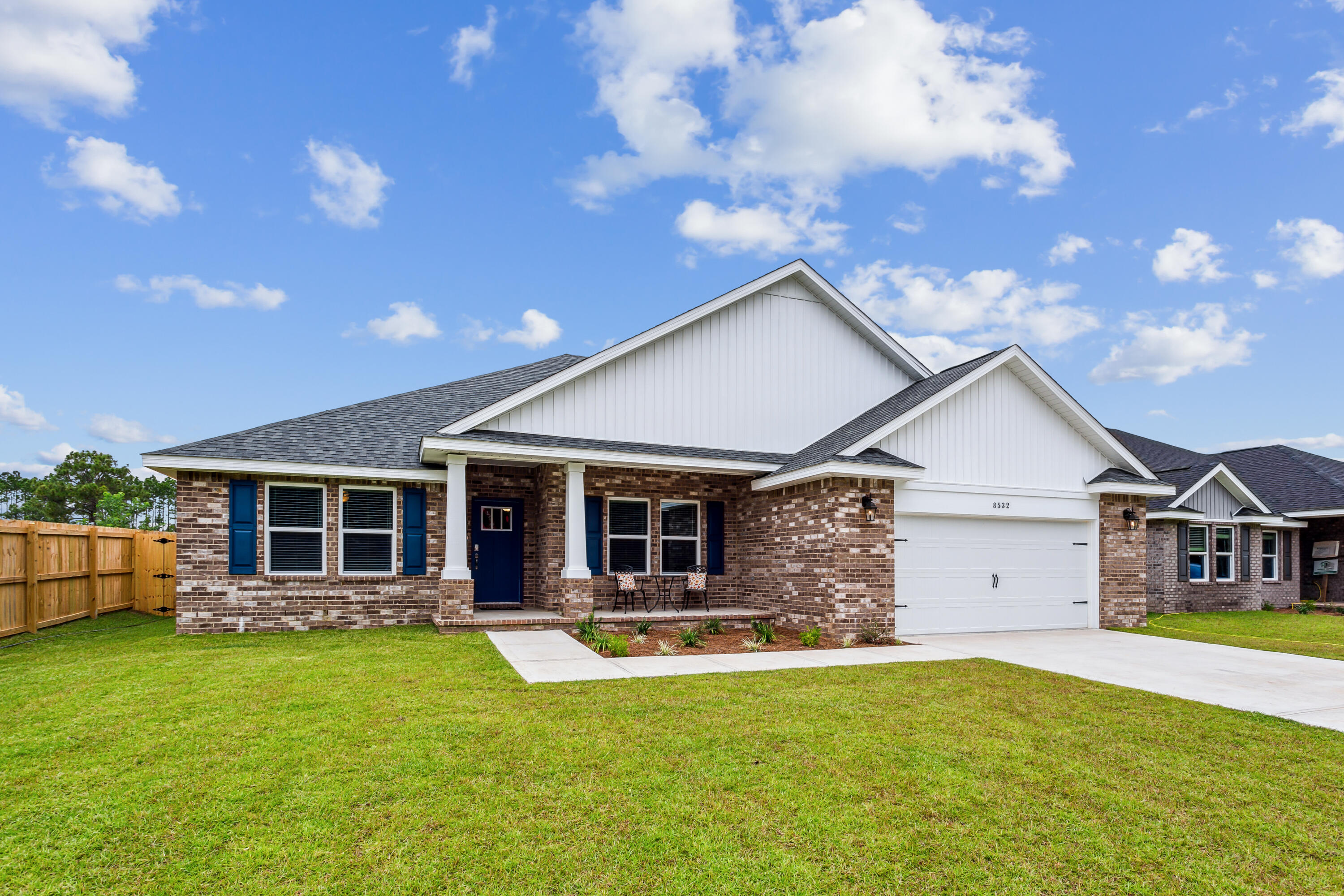 4293 Carl Booker Road Milton, FL 32583 - Photo 1 of 46 a front view of house with yard and green space