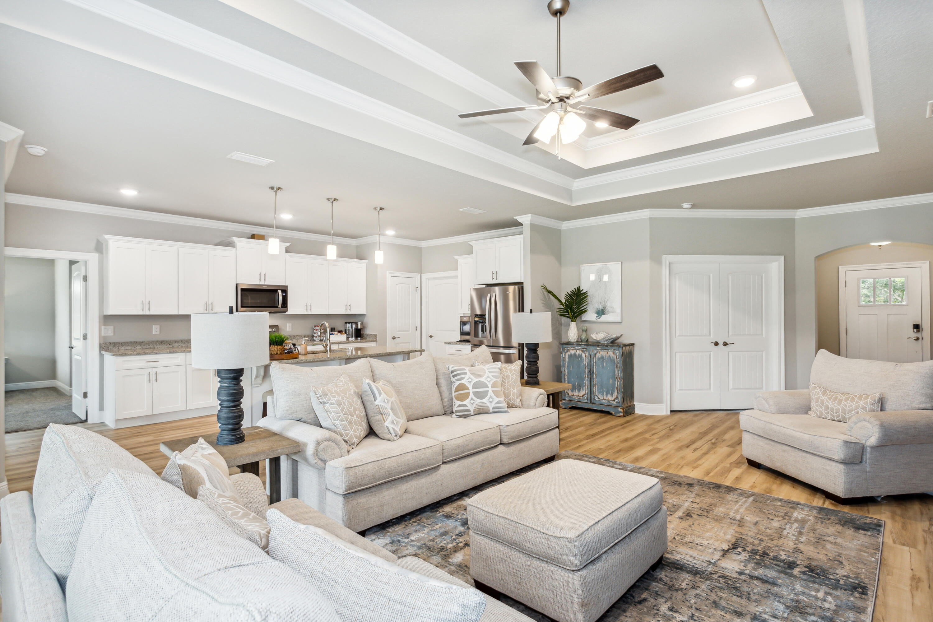 4293 Carl Booker Road Milton, FL 32583 - Photo 16 of 46 a living room with furniture and a chandelier