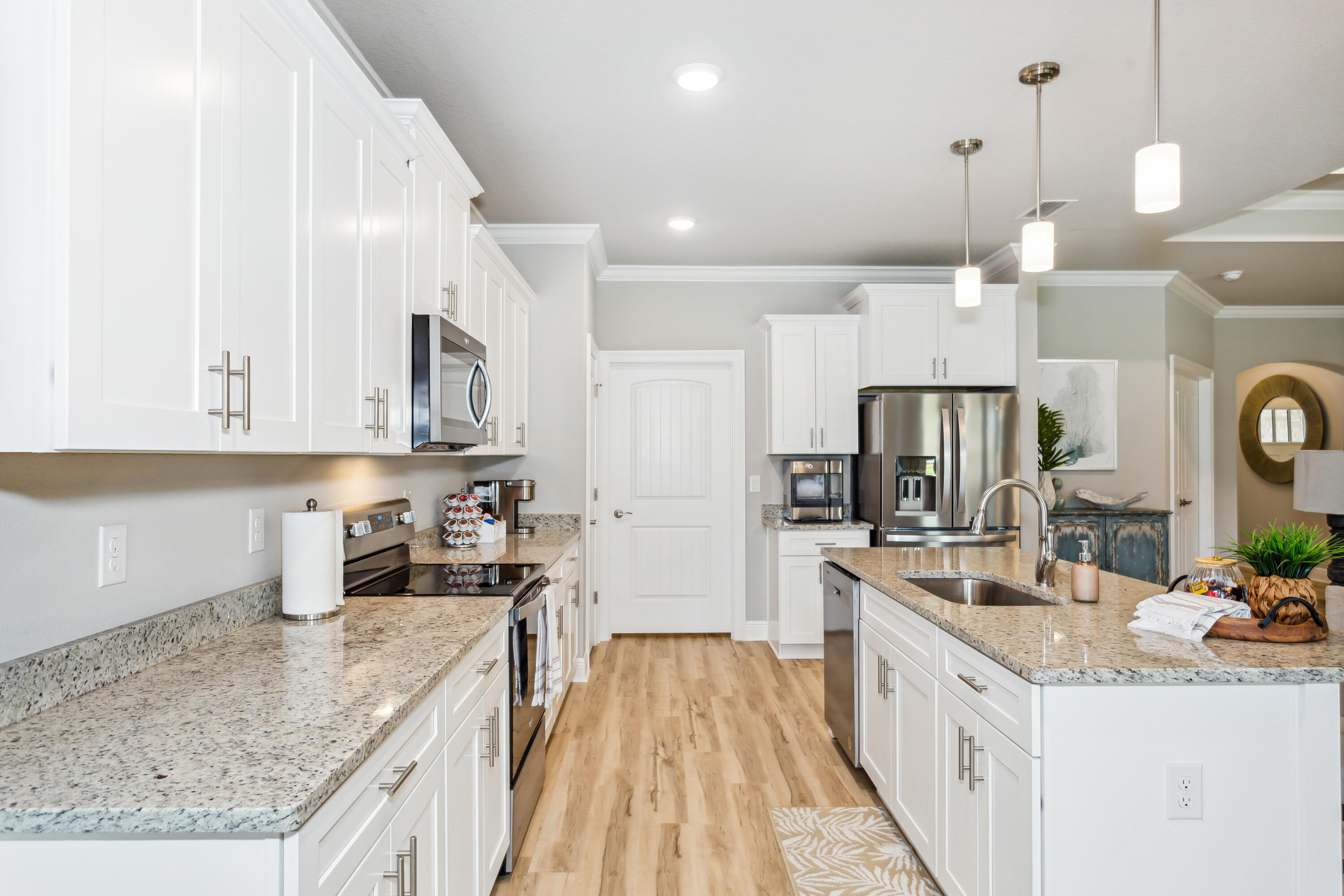 4293 Carl Booker Road Milton, FL 32583 - Photo 18 of 46 a kitchen with stainless steel appliances granite countertop a sink stove and refrigerator