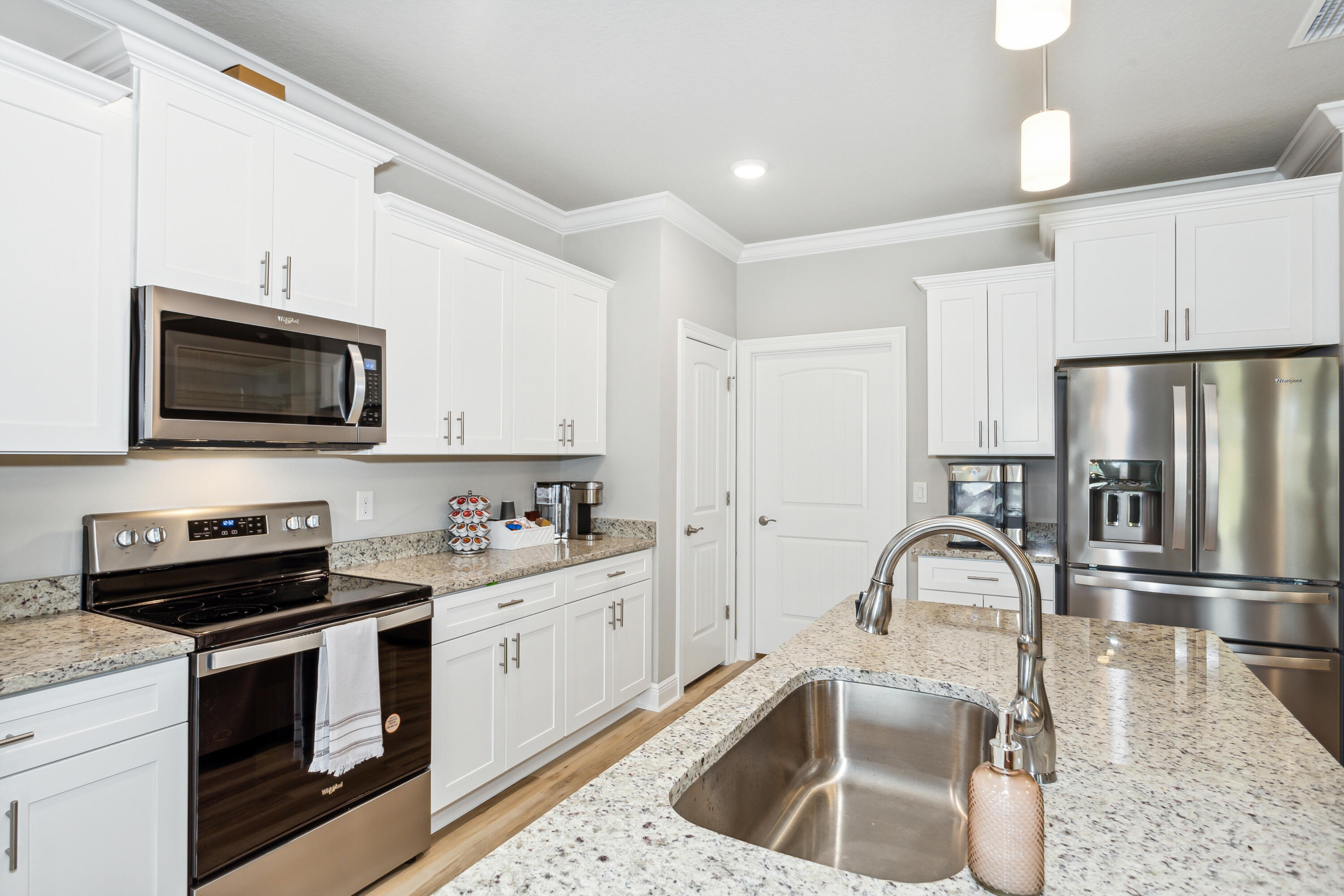 4293 Carl Booker Road Milton, FL 32583 - Photo 19 of 46 a kitchen with a sink appliances and cabinets