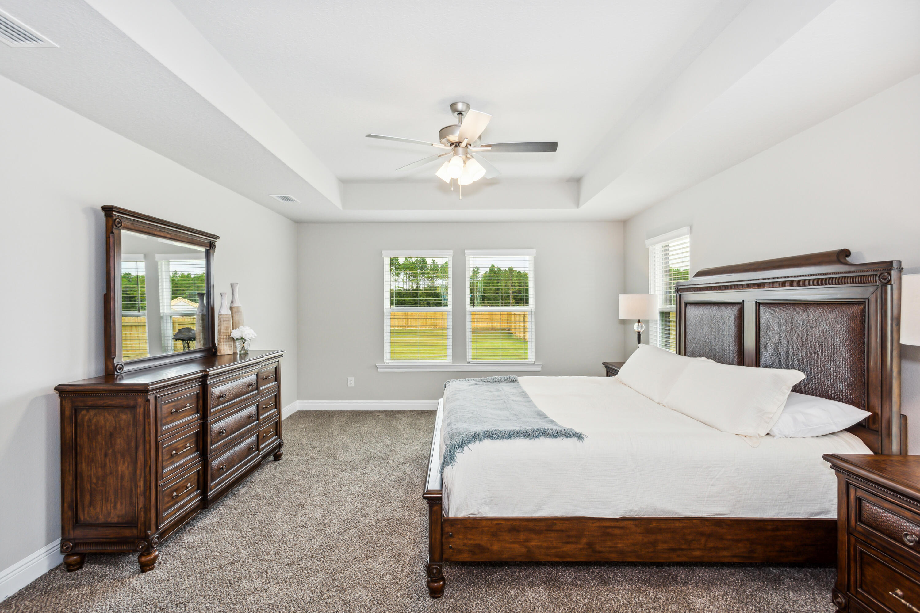 4293 Carl Booker Road Milton, FL 32583 - Photo 25 of 46 a bedroom with a bed and a chandelier