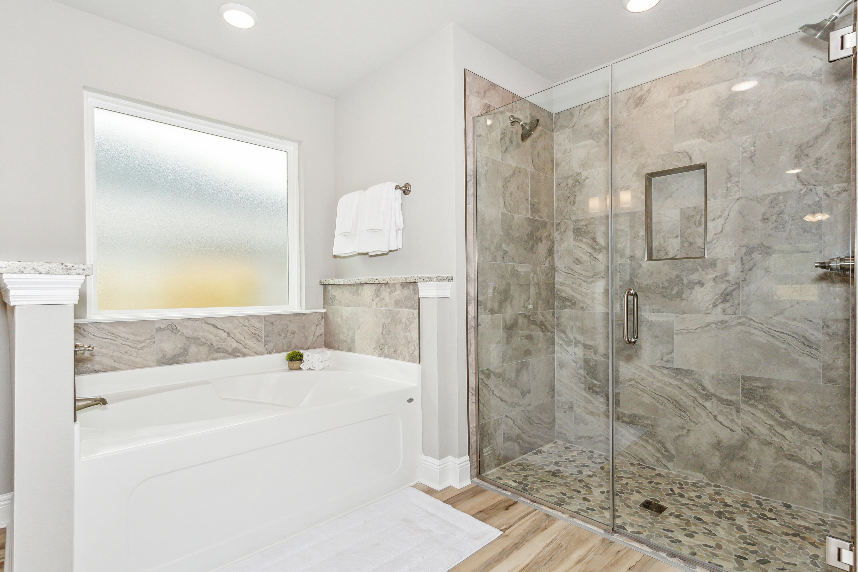 4293 Carl Booker Road Milton, FL 32583 - Photo 28 of 46 a bathroom with a bathtub and a shower