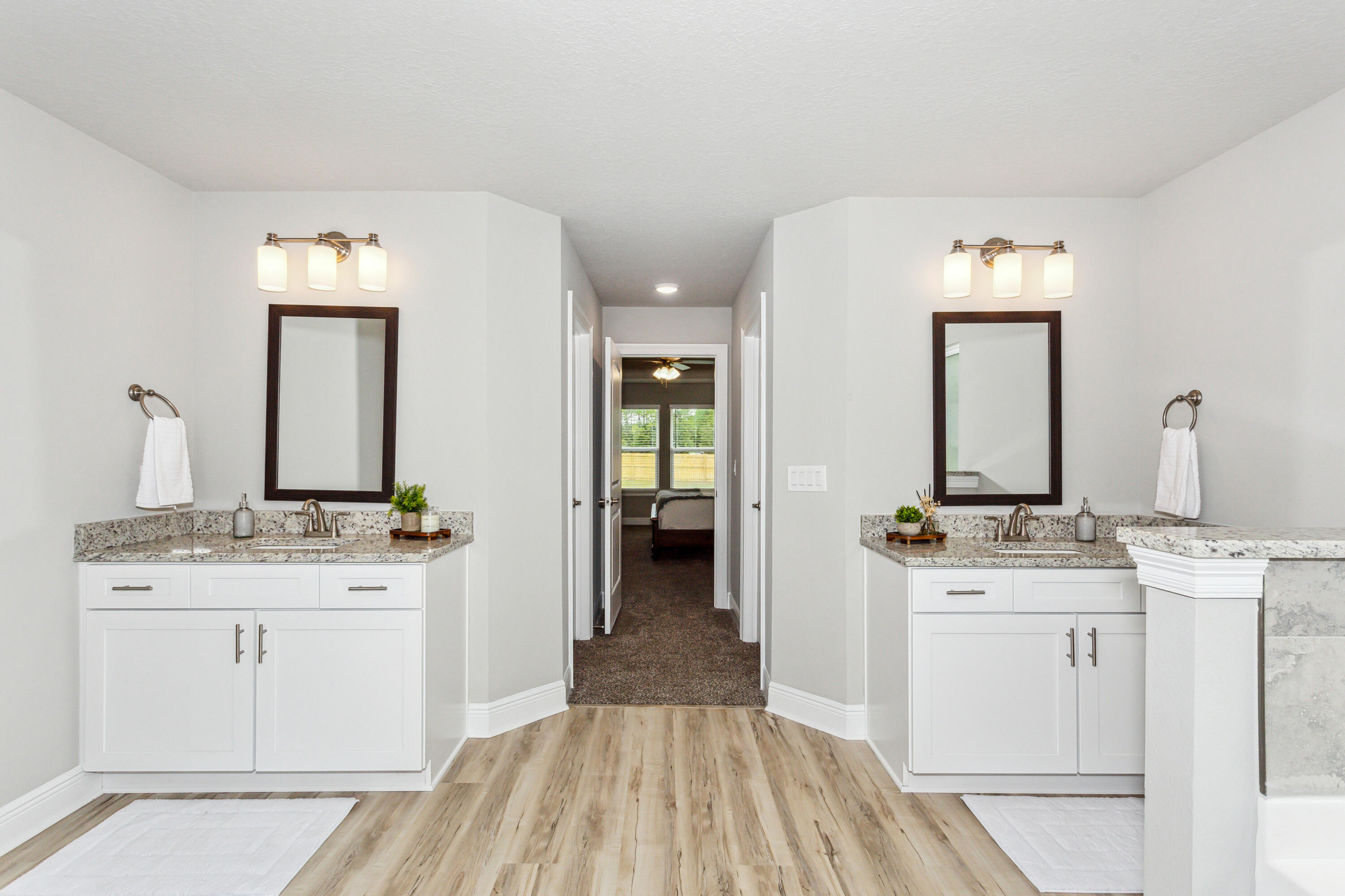 4293 Carl Booker Road Milton, FL 32583 - Photo 29 of 46 a en suite bathroom with a granite countertop sink and a mirror