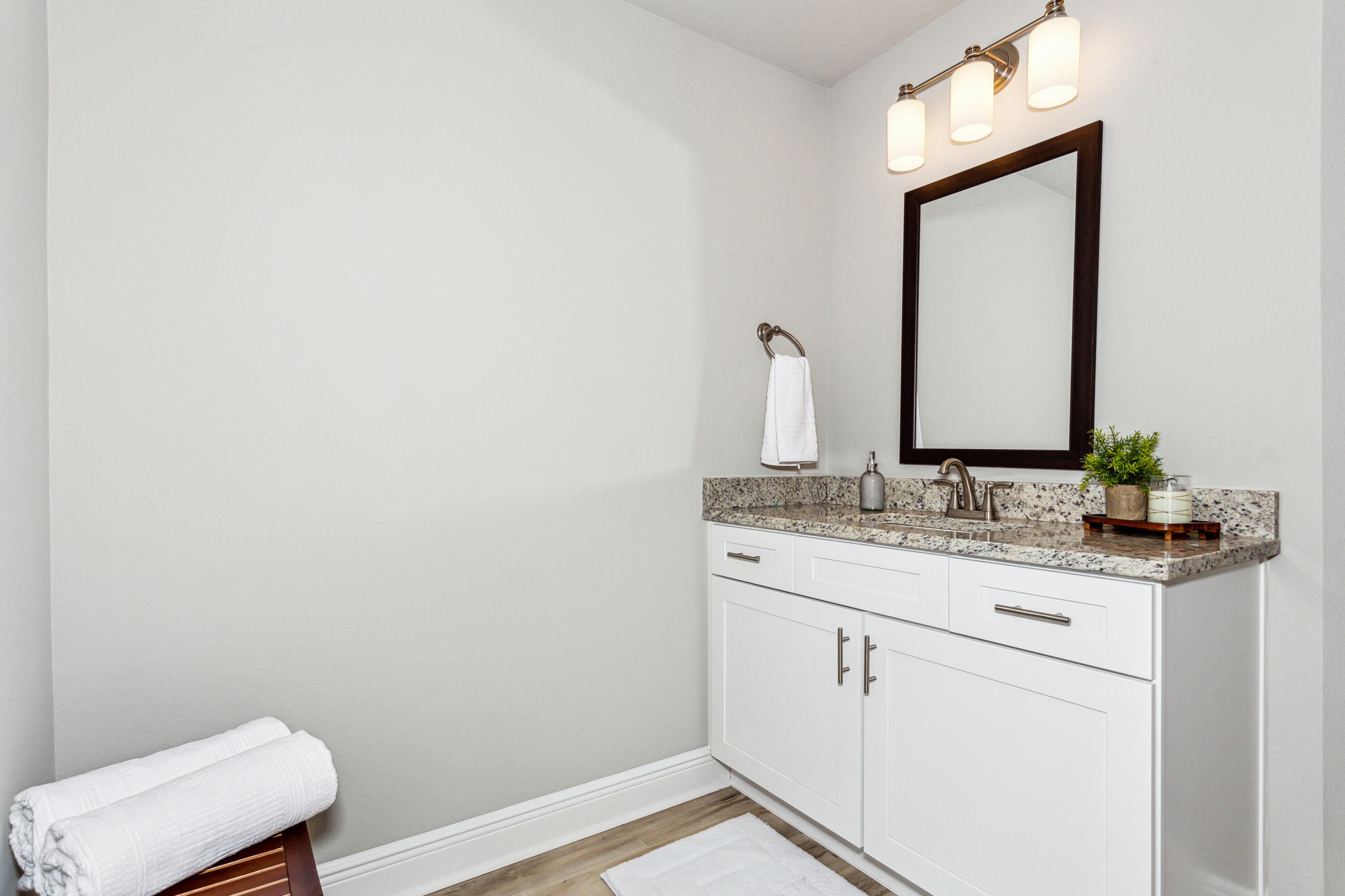4293 Carl Booker Road Milton, FL 32583 - Photo 31 of 46 a bathroom with a granite countertop sink and a toilet