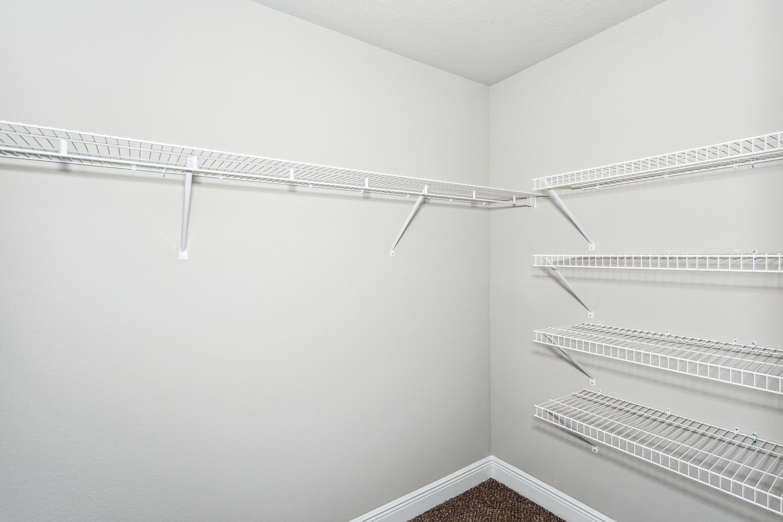 4293 Carl Booker Road Milton, FL 32583 - Photo 32 of 46 a view of a room with racks on the wall