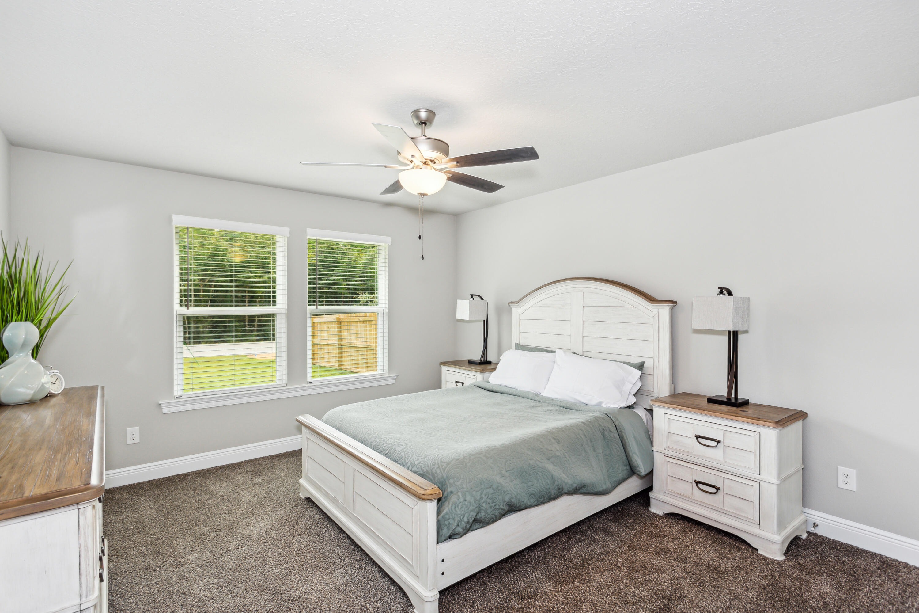 4293 Carl Booker Road Milton, FL 32583 - Photo 33 of 46 a bedroom with a bed and a window