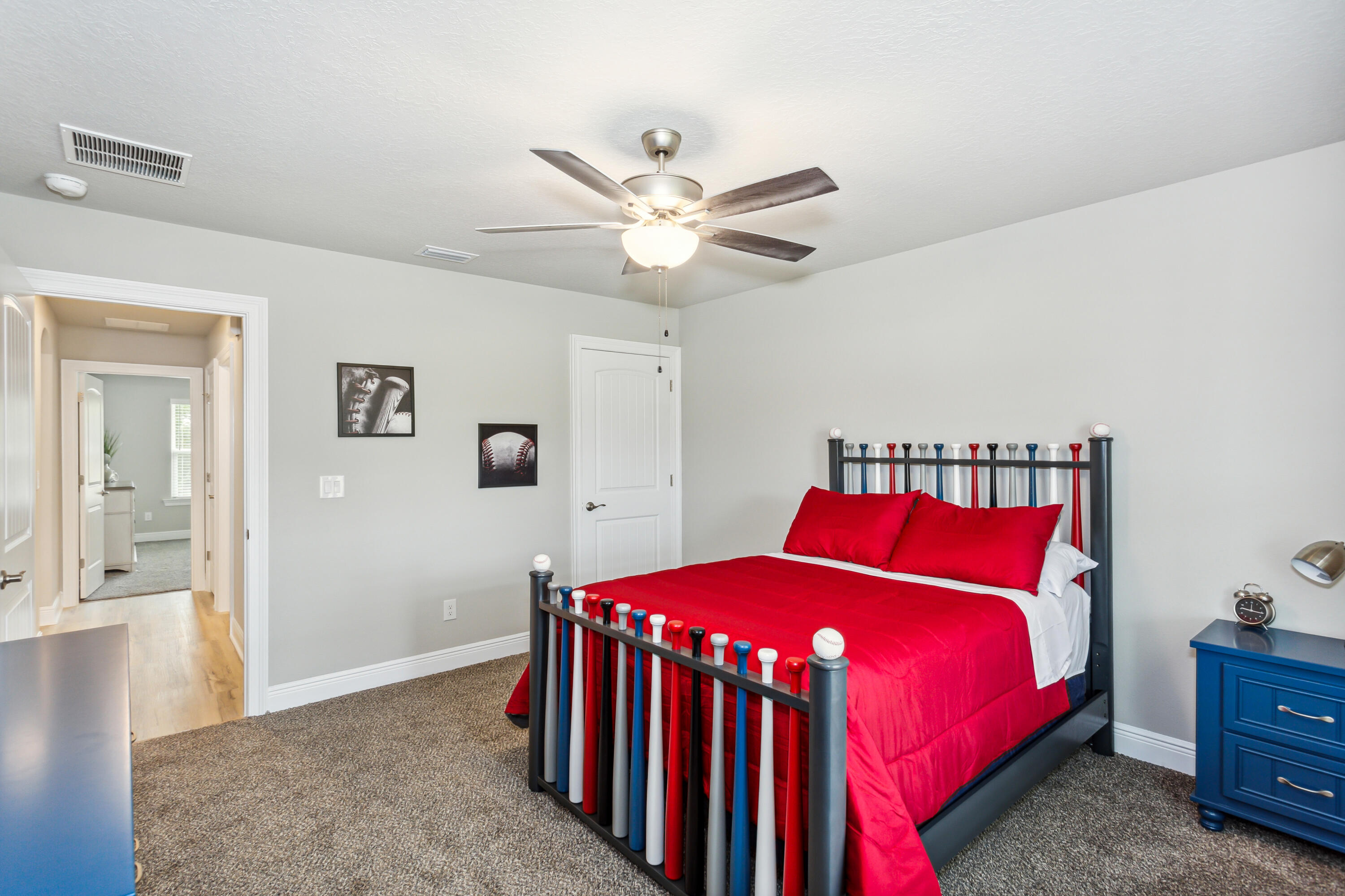 4293 Carl Booker Road Milton, FL 32583 - Photo 36 of 46 a bedroom with a bed and a chandelier
