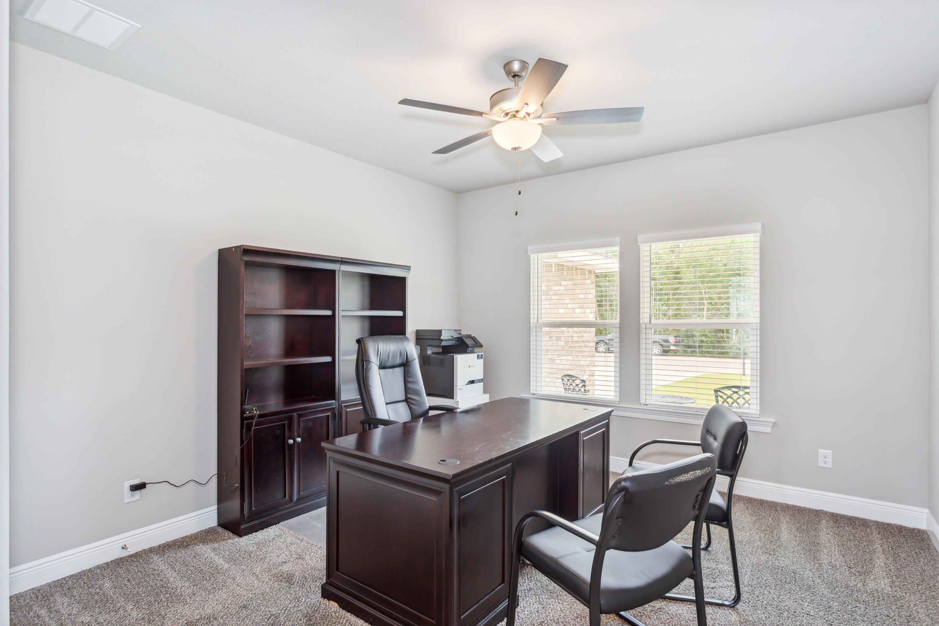 4293 Carl Booker Road Milton, FL 32583 - Photo 38 of 46 a view of a workspace with furniture and a window