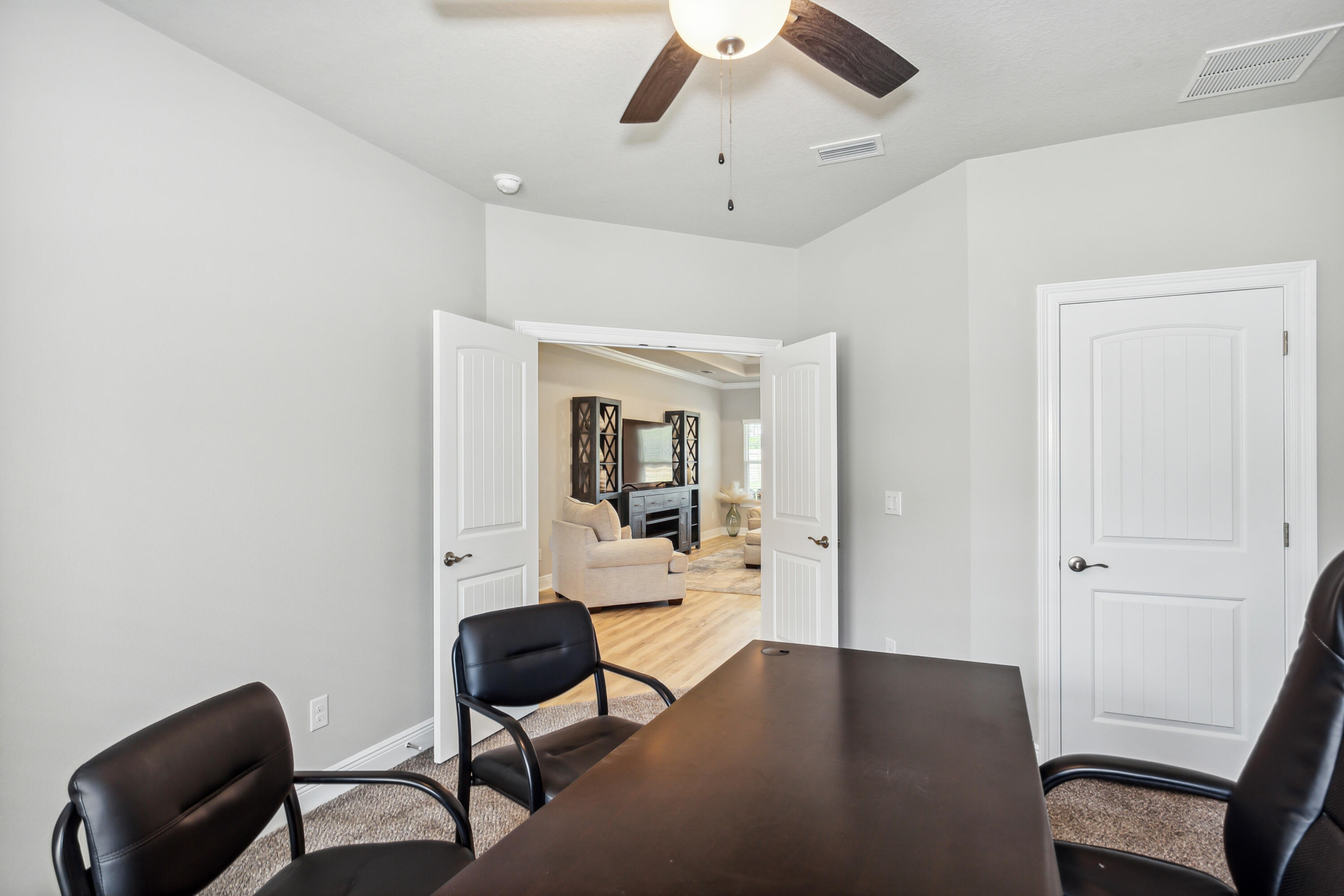 4293 Carl Booker Road Milton, FL 32583 - Photo 39 of 46 a view of a workspace with furniture and a window