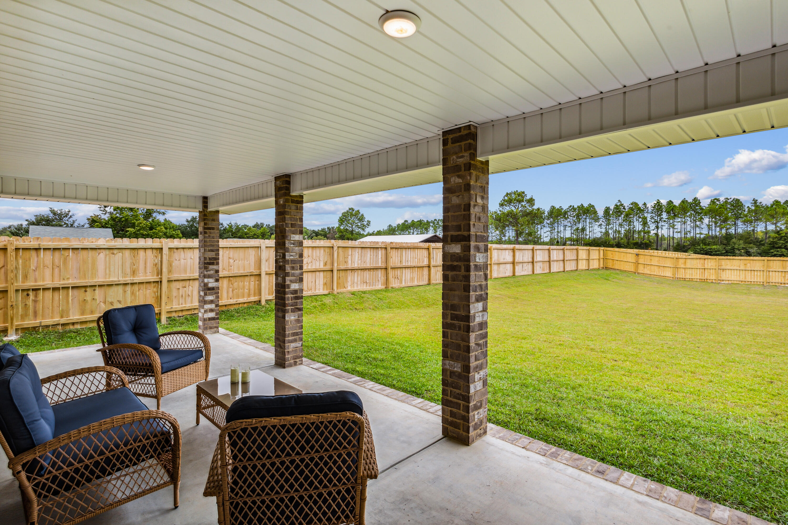 4293 Carl Booker Road Milton, FL 32583 - Photo 40 of 46 a balcony with furniture and a garden