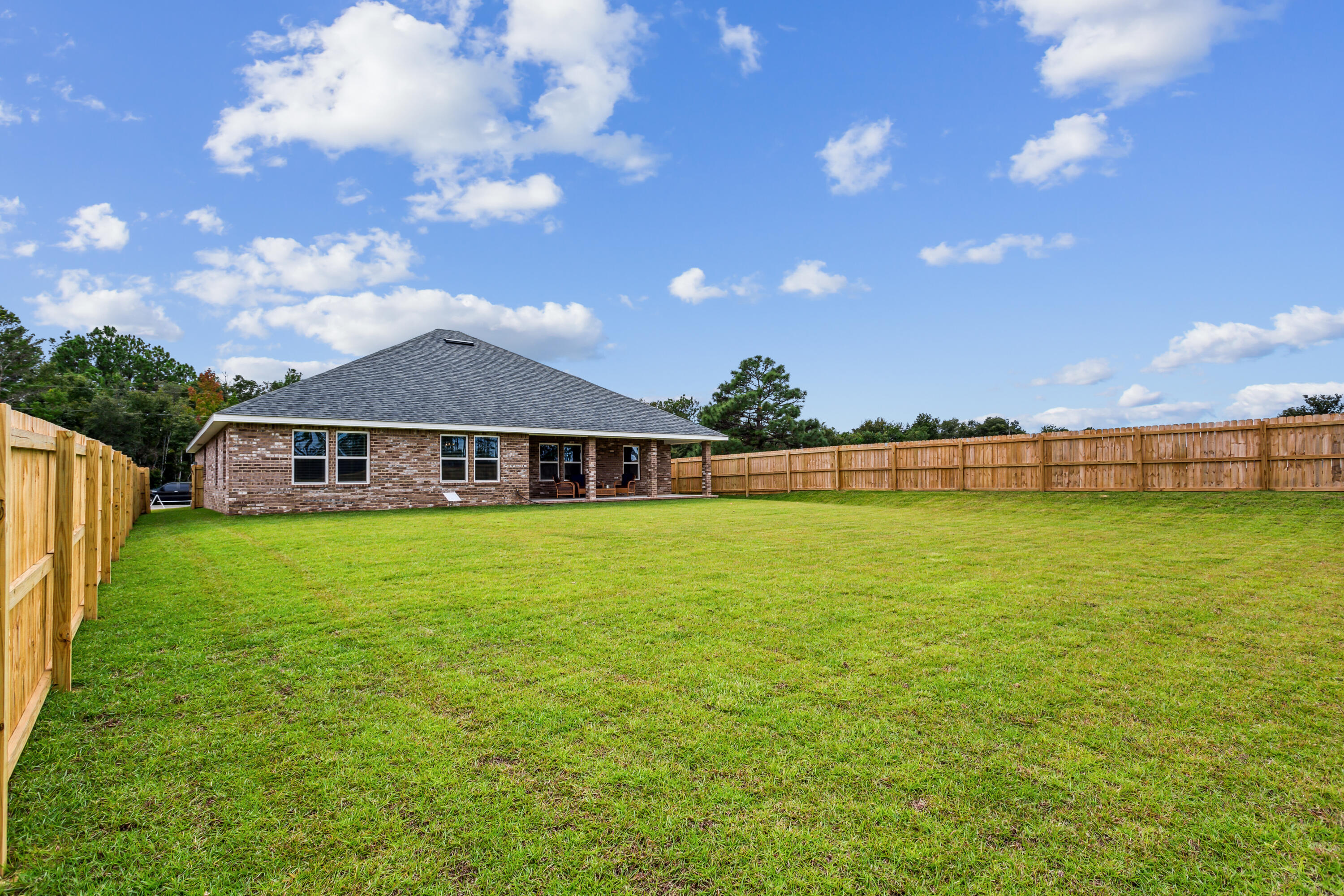 4293 Carl Booker Road Milton, FL 32583 - Photo 43 of 46 a front view of a house with garden