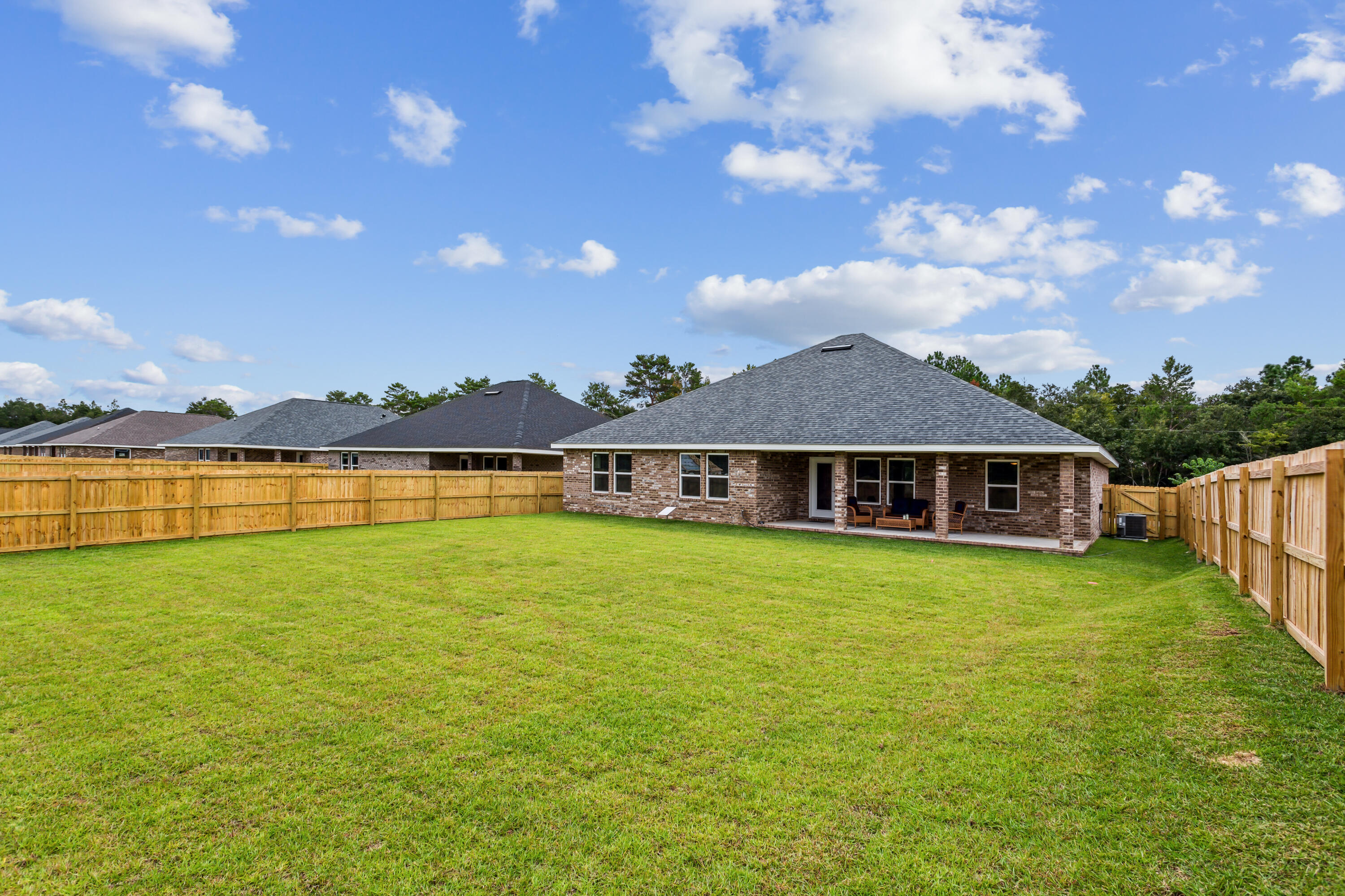 4293 Carl Booker Road Milton, FL 32583 - Photo 45 of 46 a view of a house with swimming pool and a yard
