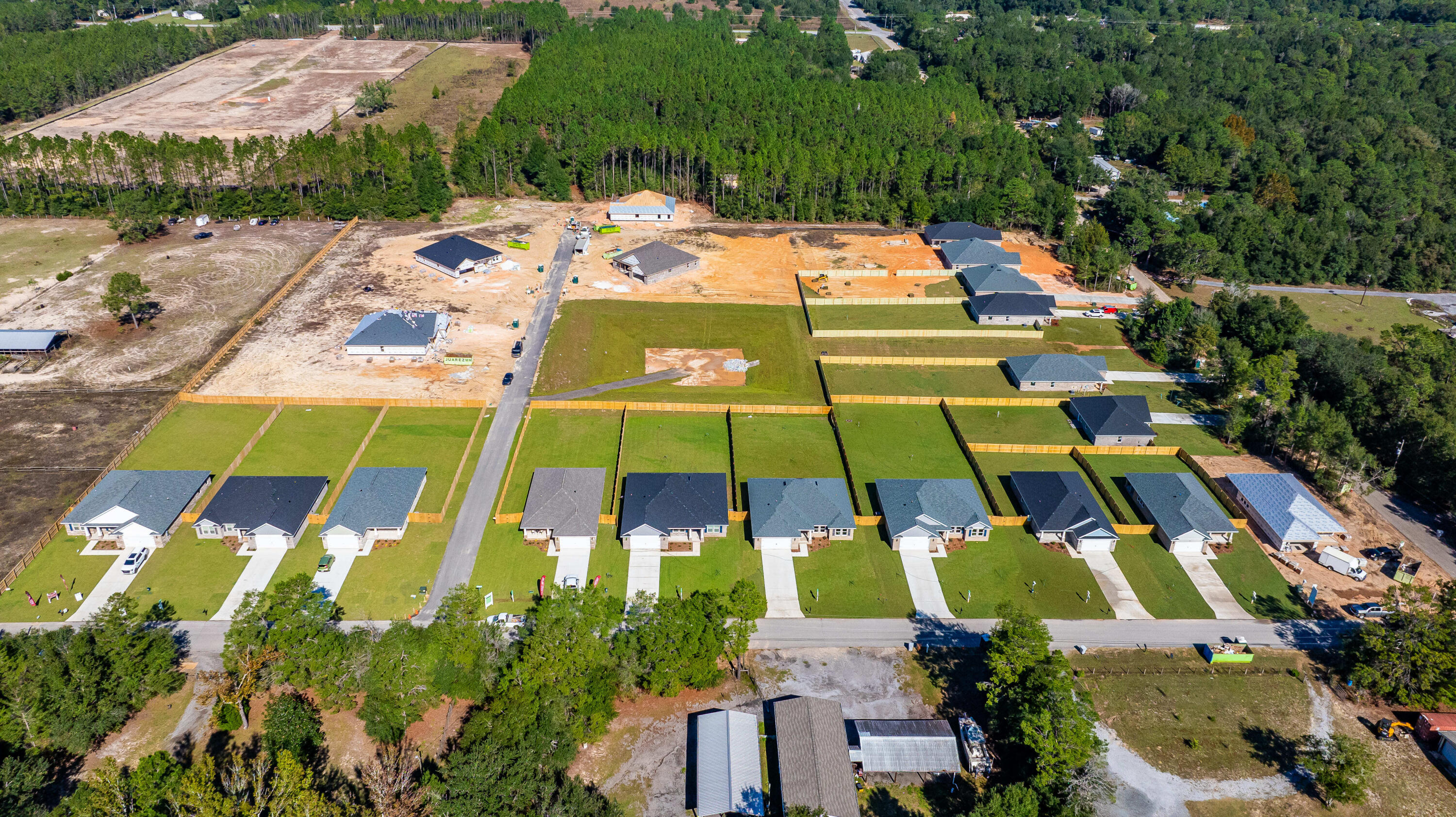 4293 Carl Booker Road Milton, FL 32583 - Photo 7 of 46 an aerial view of a tennis ground and large trees
