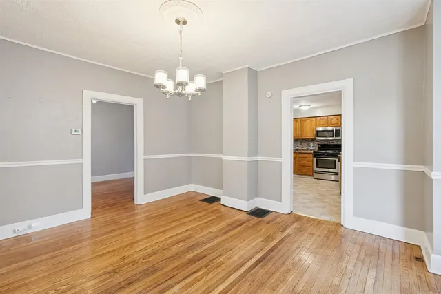 a view of a livingroom with wooden floor